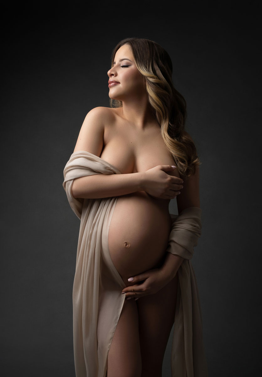 Maternity portrait of woman in silk outfit